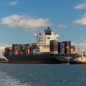 cargo ship on sea under blue sky during daytime