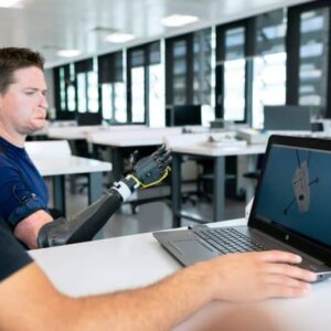man in blue crew neck t-shirt using black laptop computer
